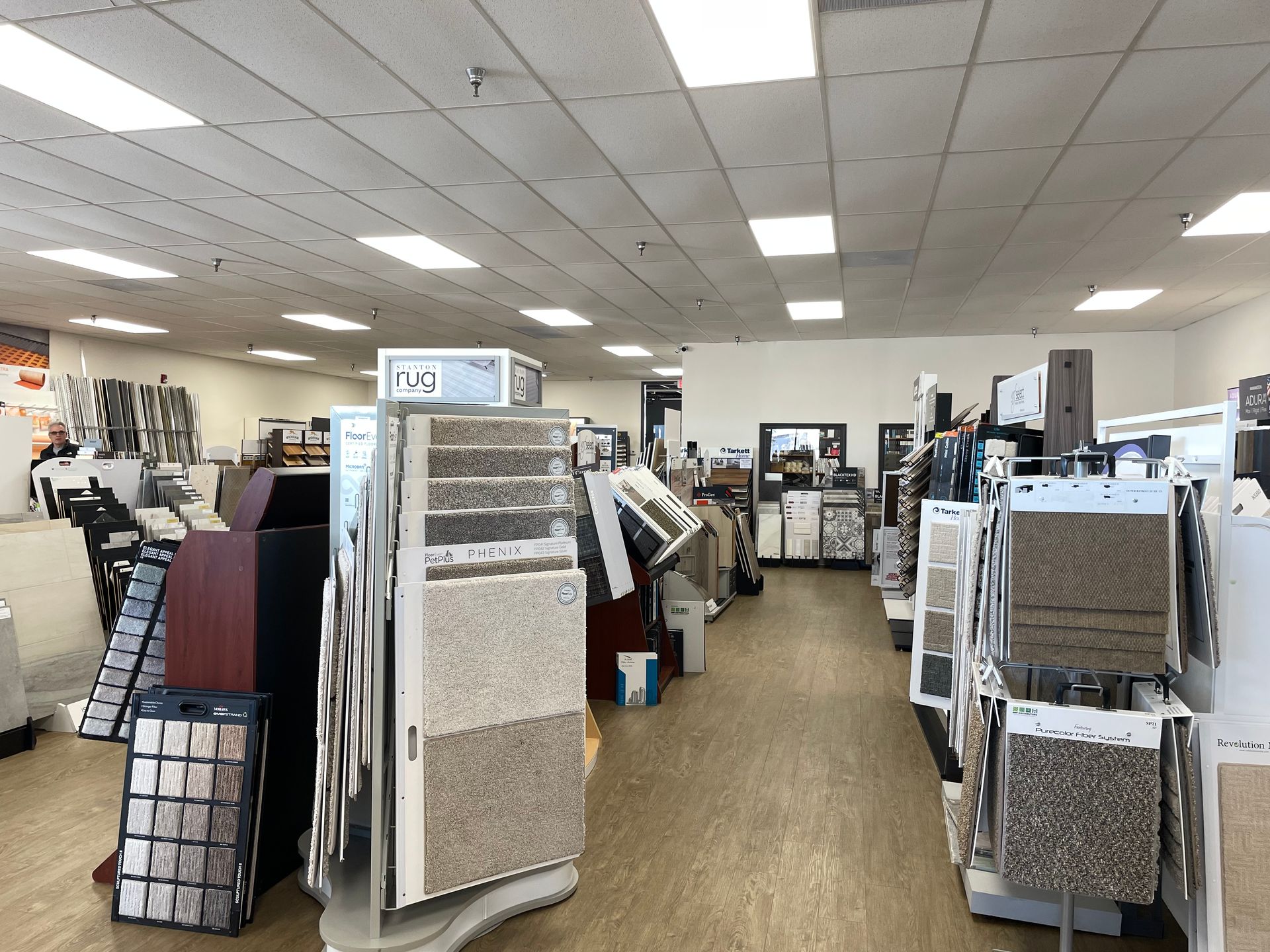 A large room filled with lots of carpets and tiles.