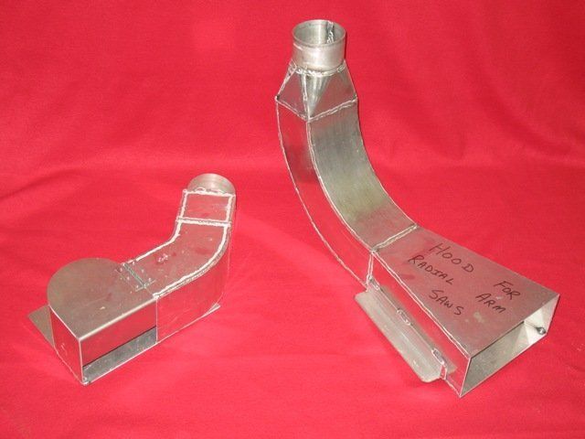 Two pieces of metal are sitting on a red surface and one of them has the number 10 on it