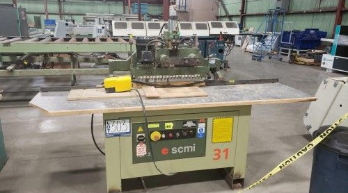 A machine with the number 31 on it is sitting in a warehouse.