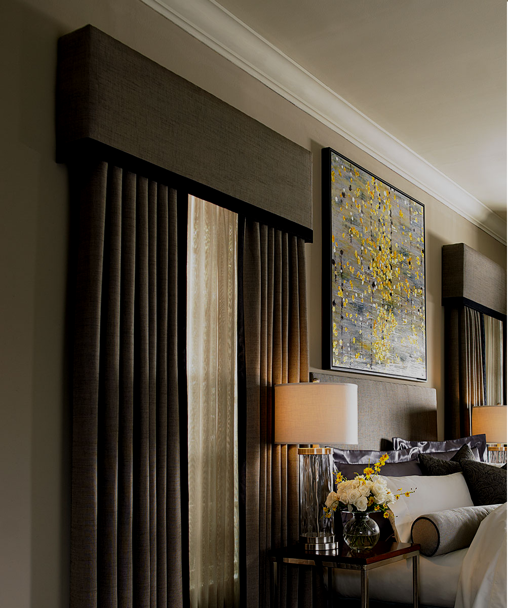 A living room with a couch and two lamps