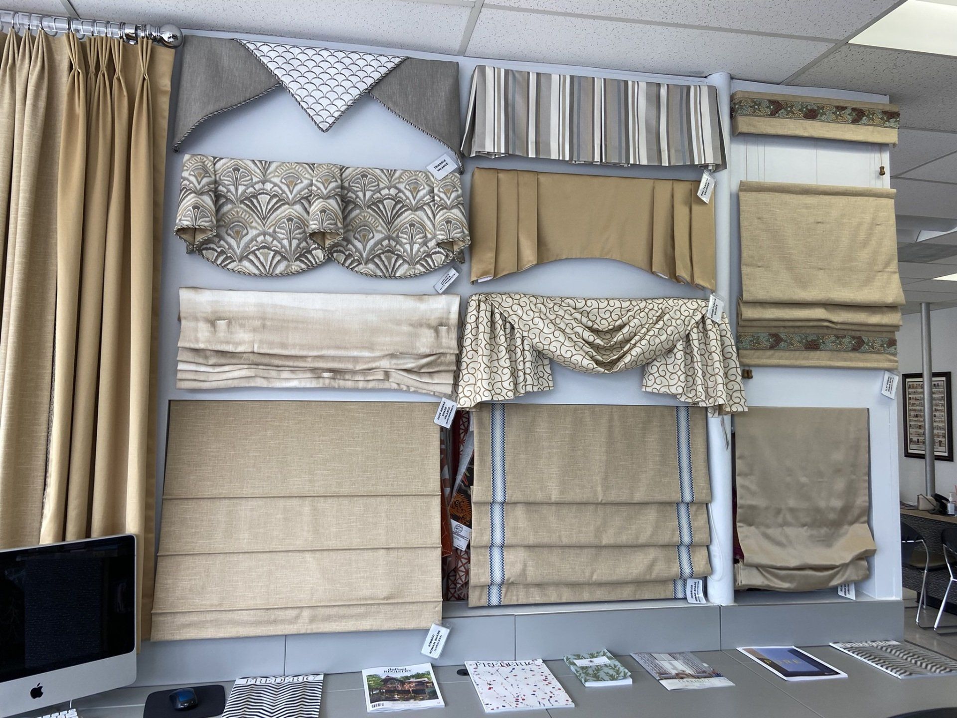A wall with a lot of different types of curtains on it