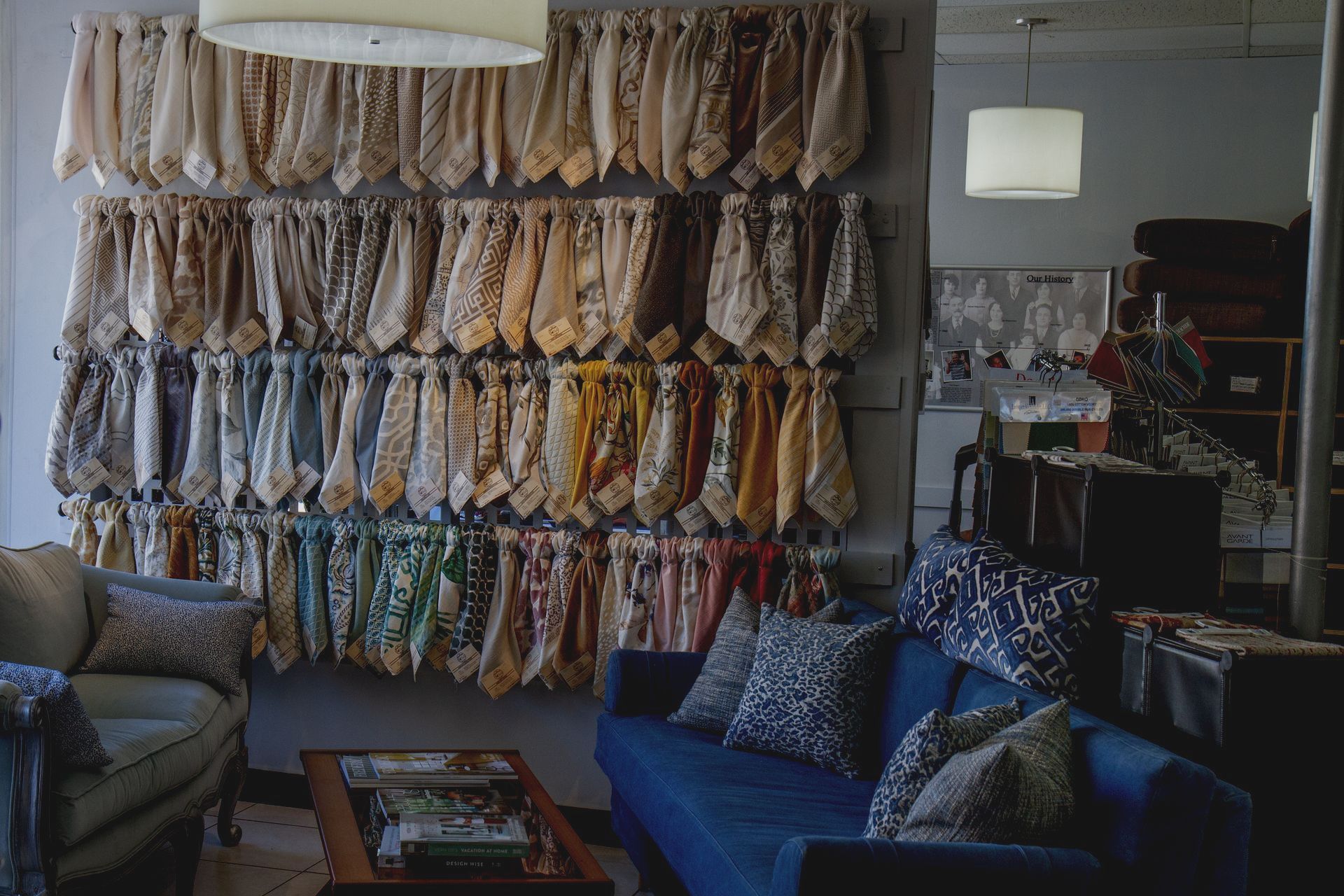 A living room with a blue couch and a coffee table