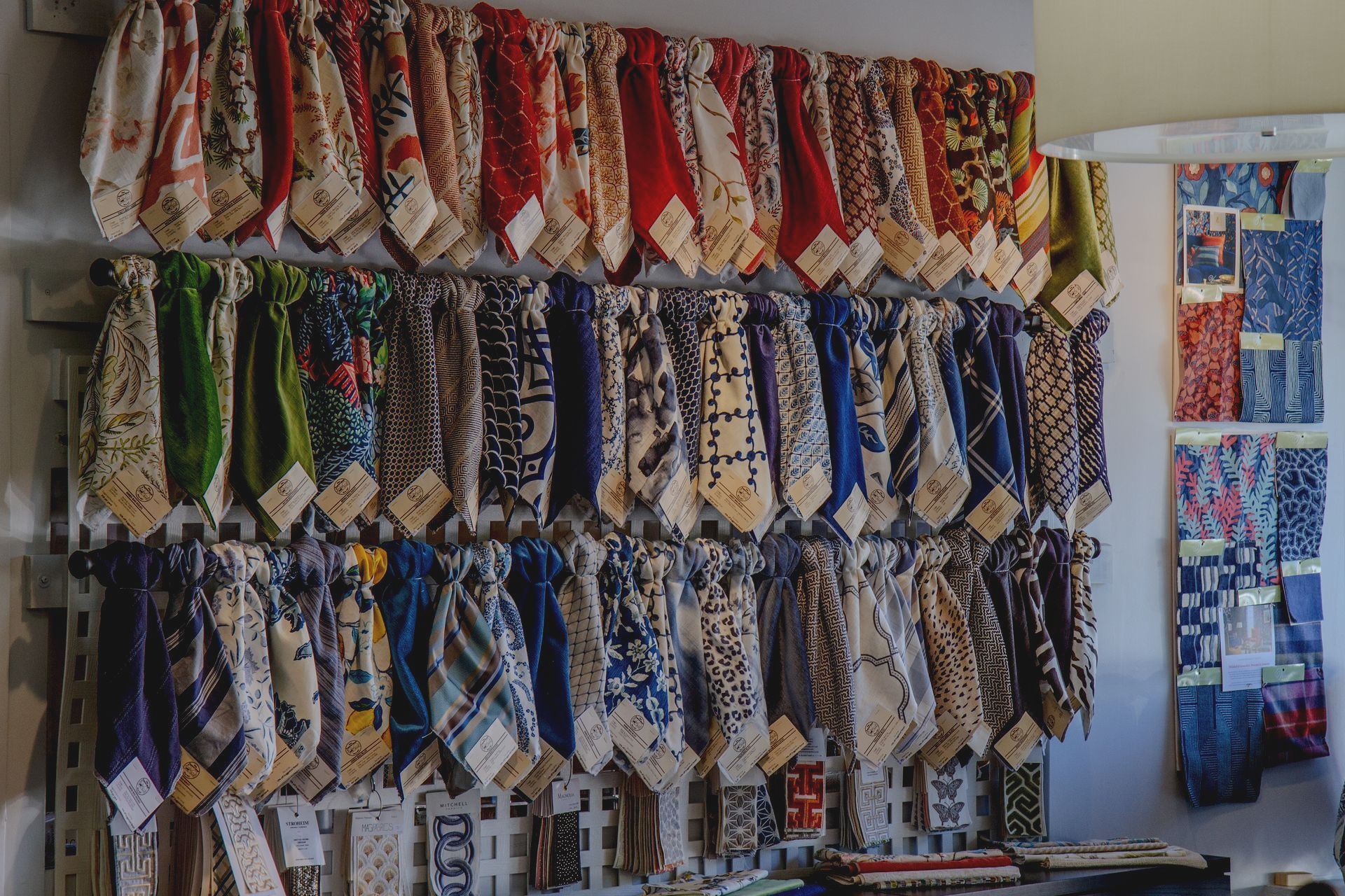 A bunch of ties are hanging on a wall