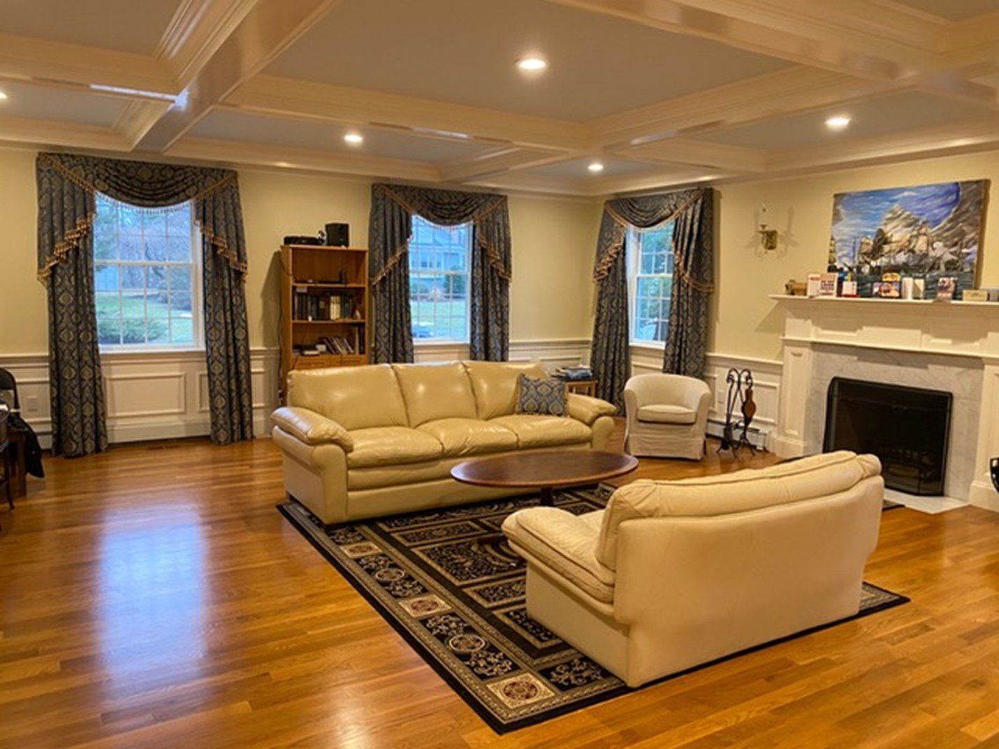 A living room filled with furniture and a fireplace.