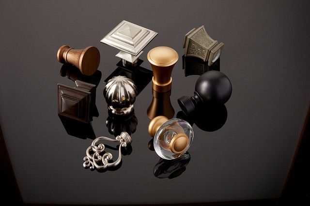 A group of metal objects are sitting on a black surface.