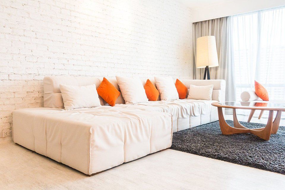 A living room with a couch and a coffee table.