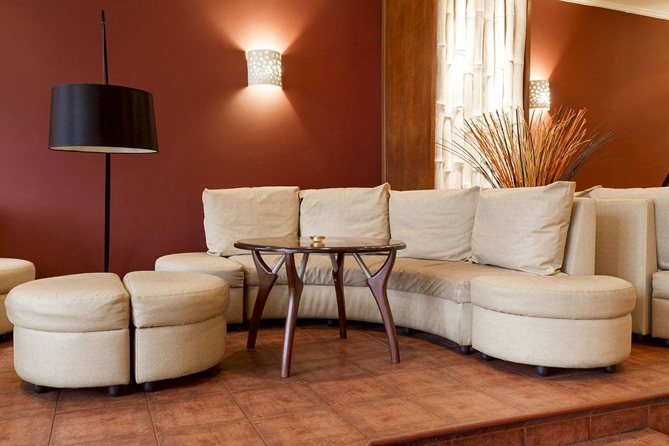 A living room with a couch and a table