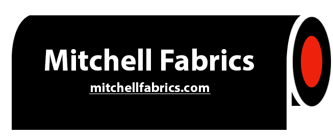 A black sign that says mitchell fabrics on it
