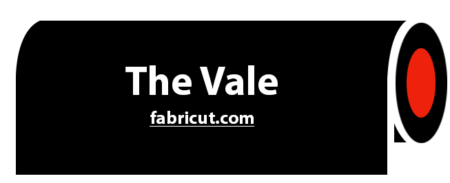 A black sign that says the vale fabricut.com