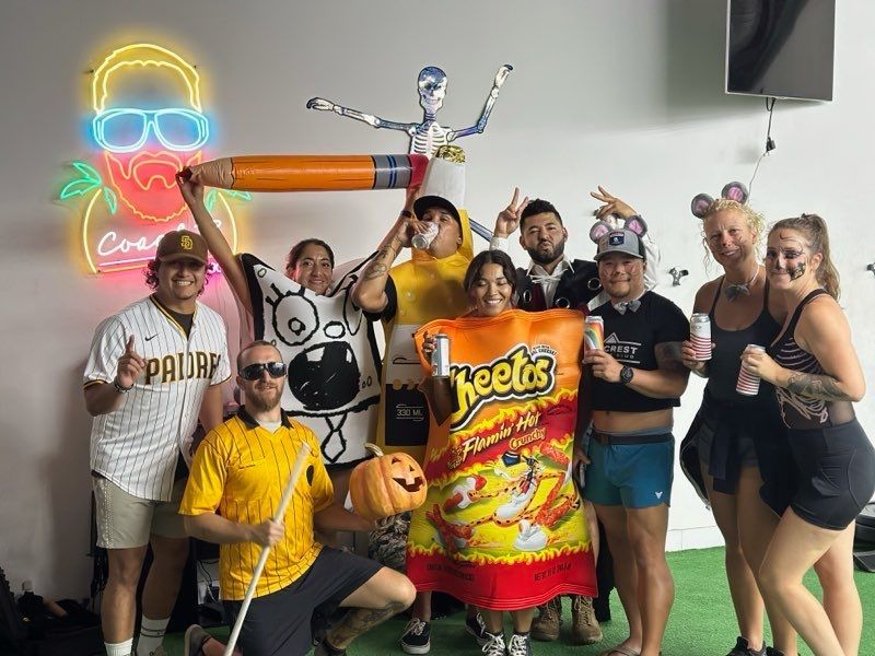 A group of people are posing for a picture in a room.