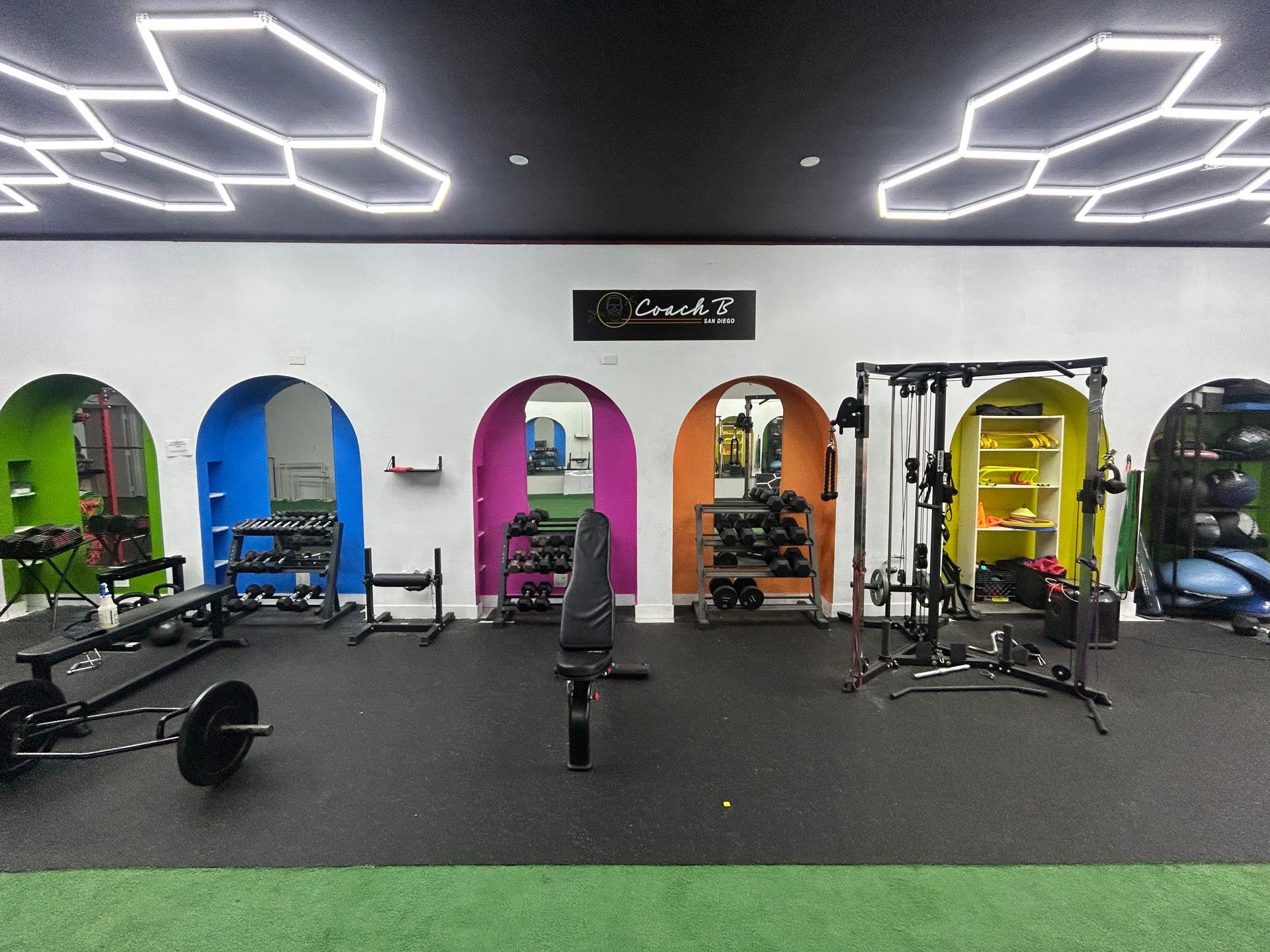 A gym with a lot of exercise equipment in it