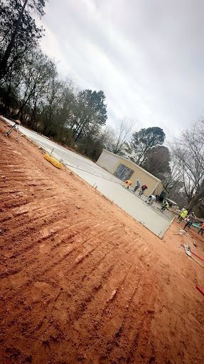 A group of people are working on a construction site.