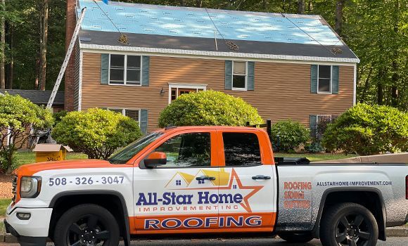 All-Star Home Improvement Inc truck in front of residential roofing