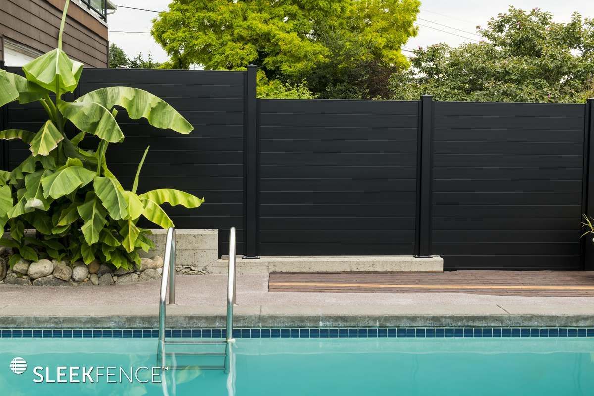 Beautiful black fence surrounding pool