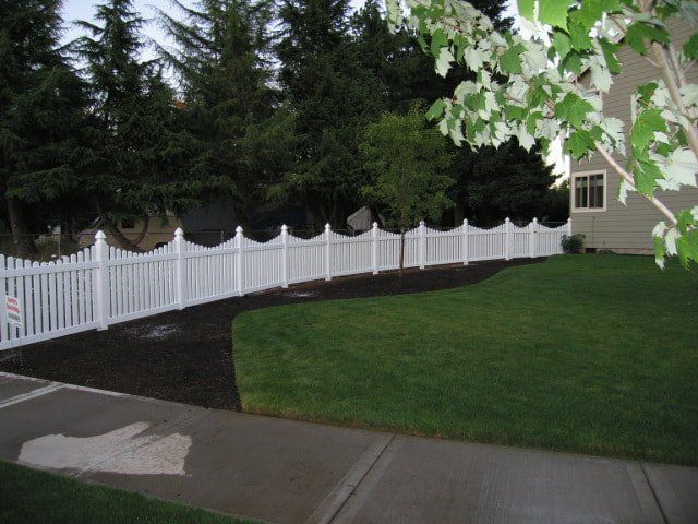 white curved fence