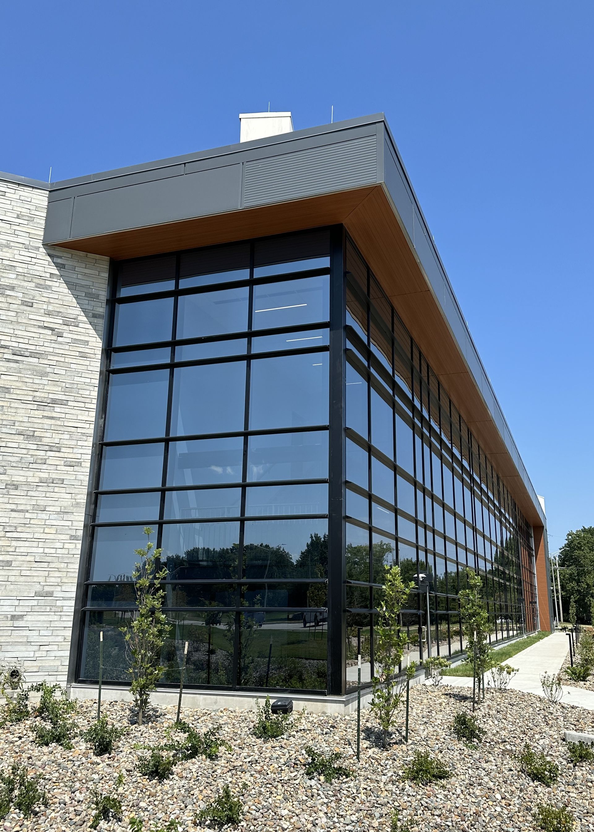 A large building with a lot of windows on a sunny day