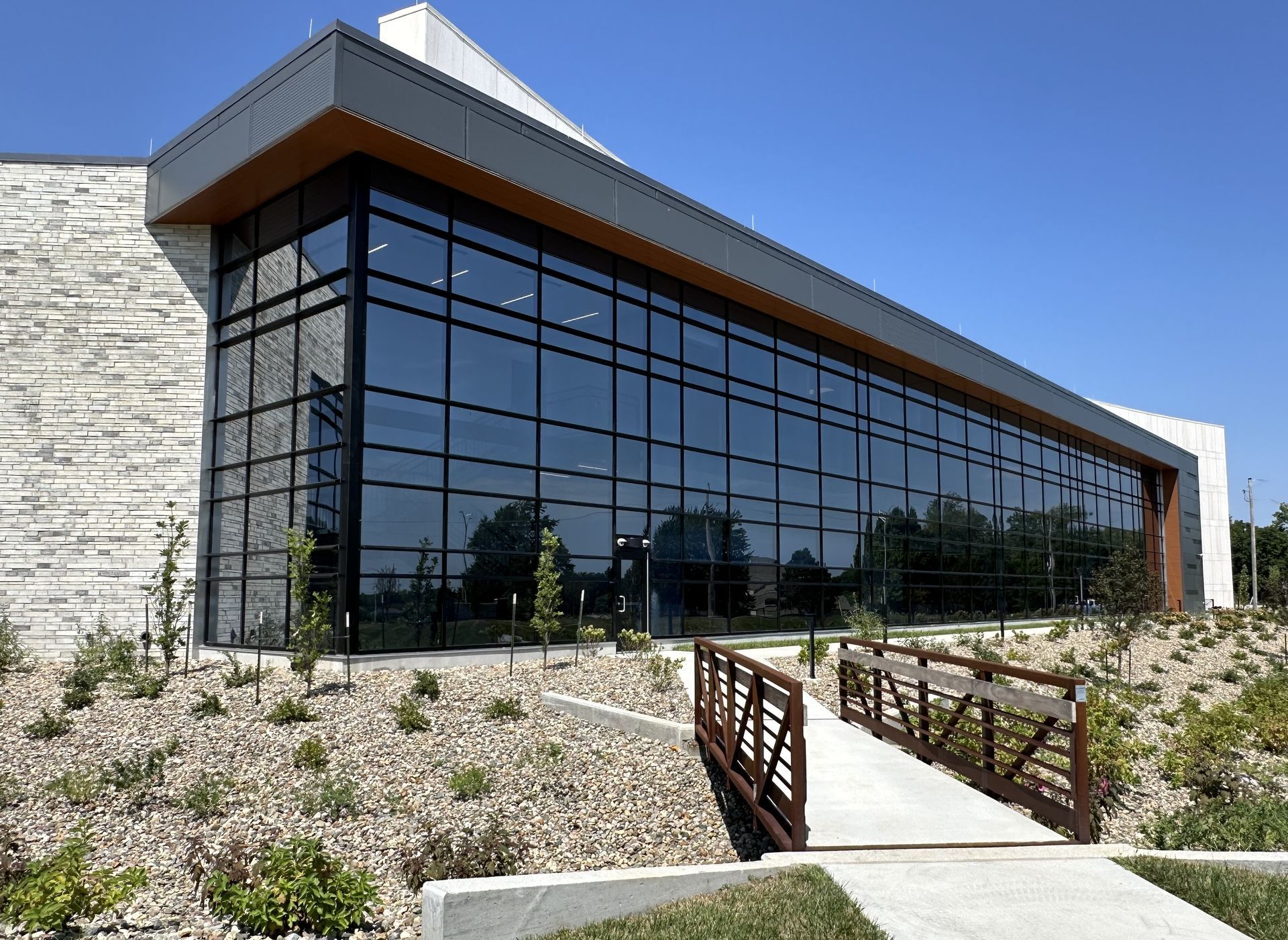 A large building with a bridge in front of it