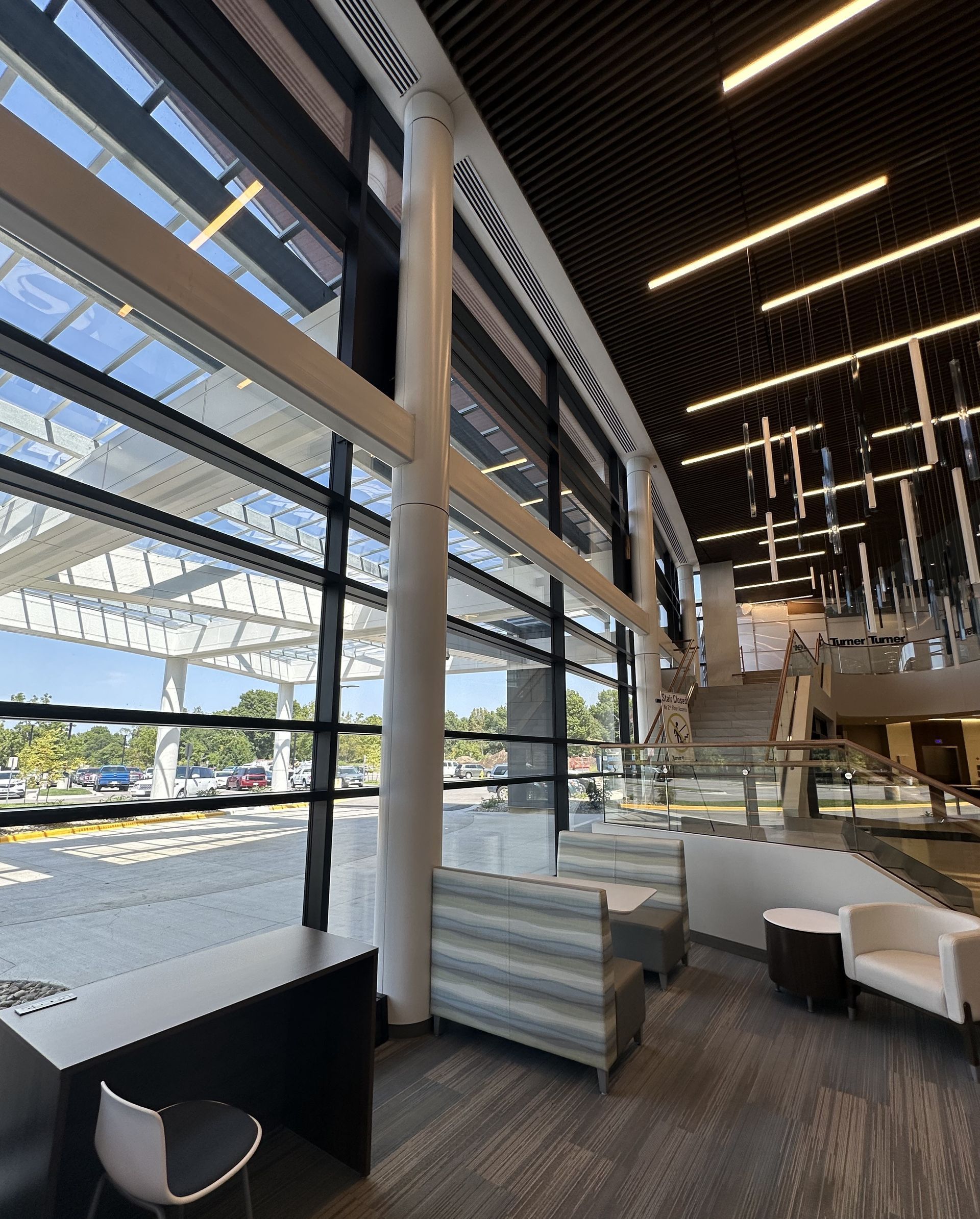 A large room with a lot of windows and furniture