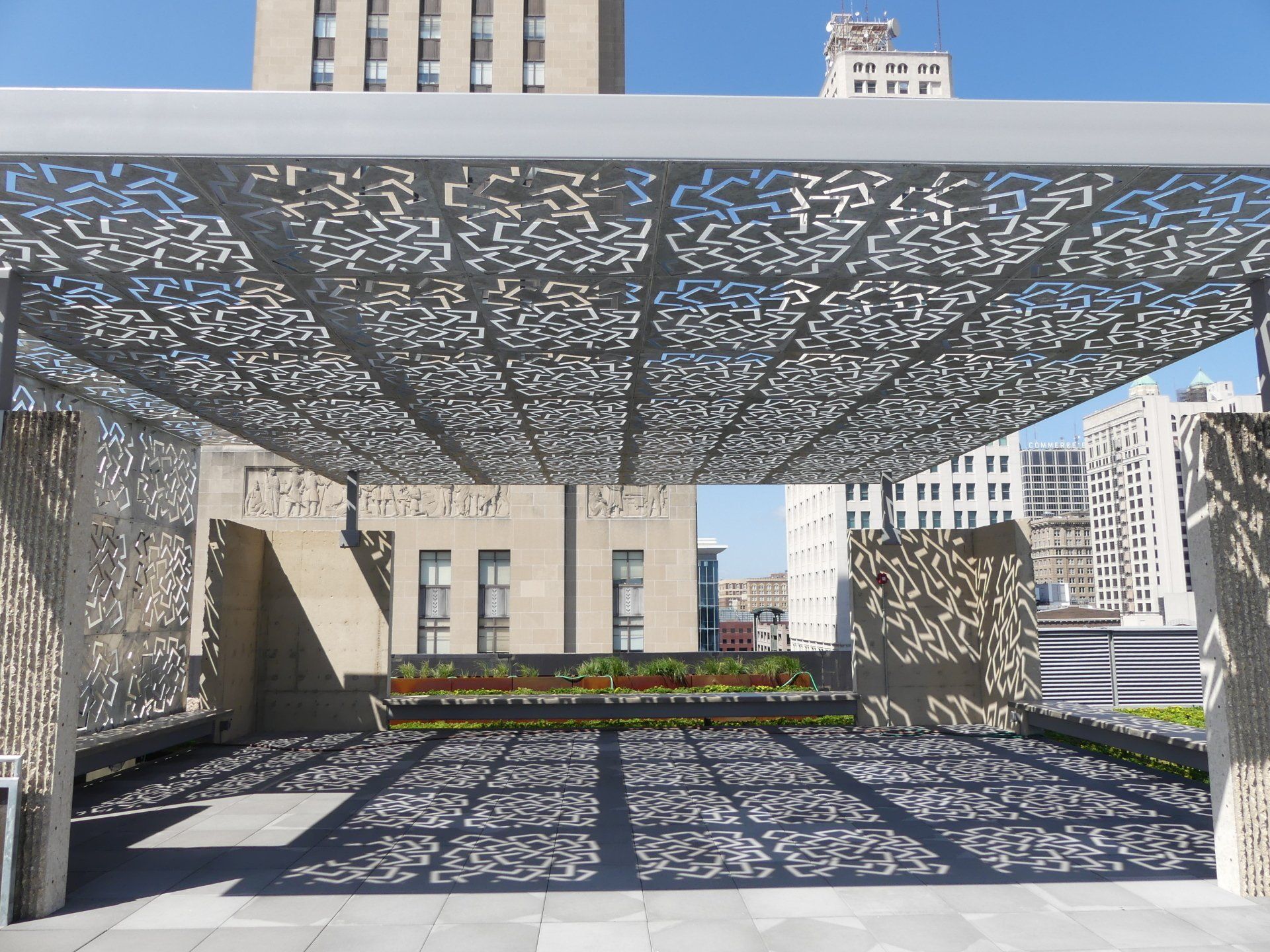 A rooftop with a canopy that has a pattern on it