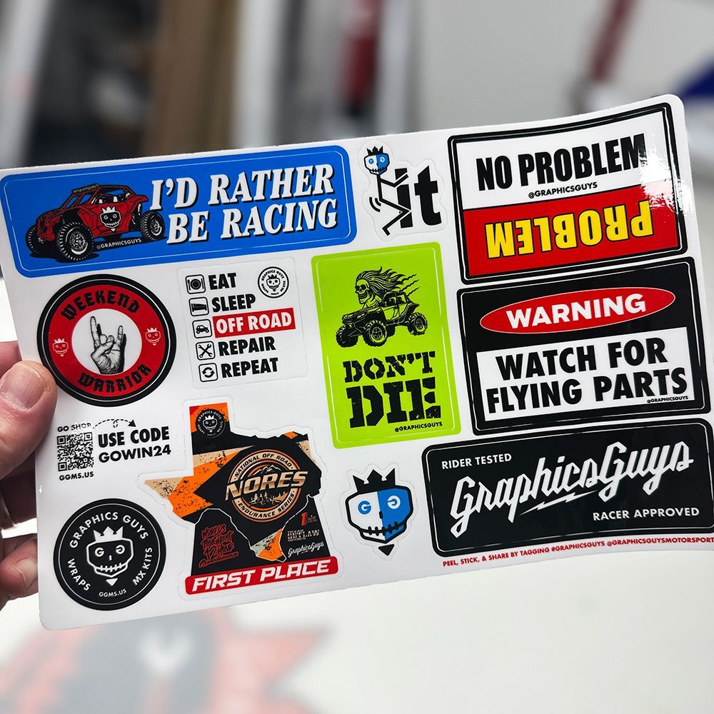 Sticker sheet with colorful racing and warning decals, including “I’d rather be racing” and “No problem”