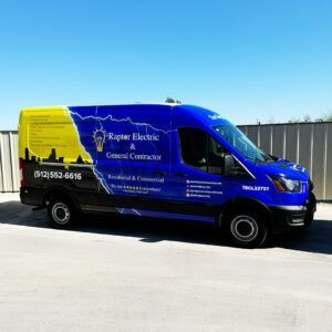 Blue and yellow Raptor Electric van parked outdoors with business branding on the side