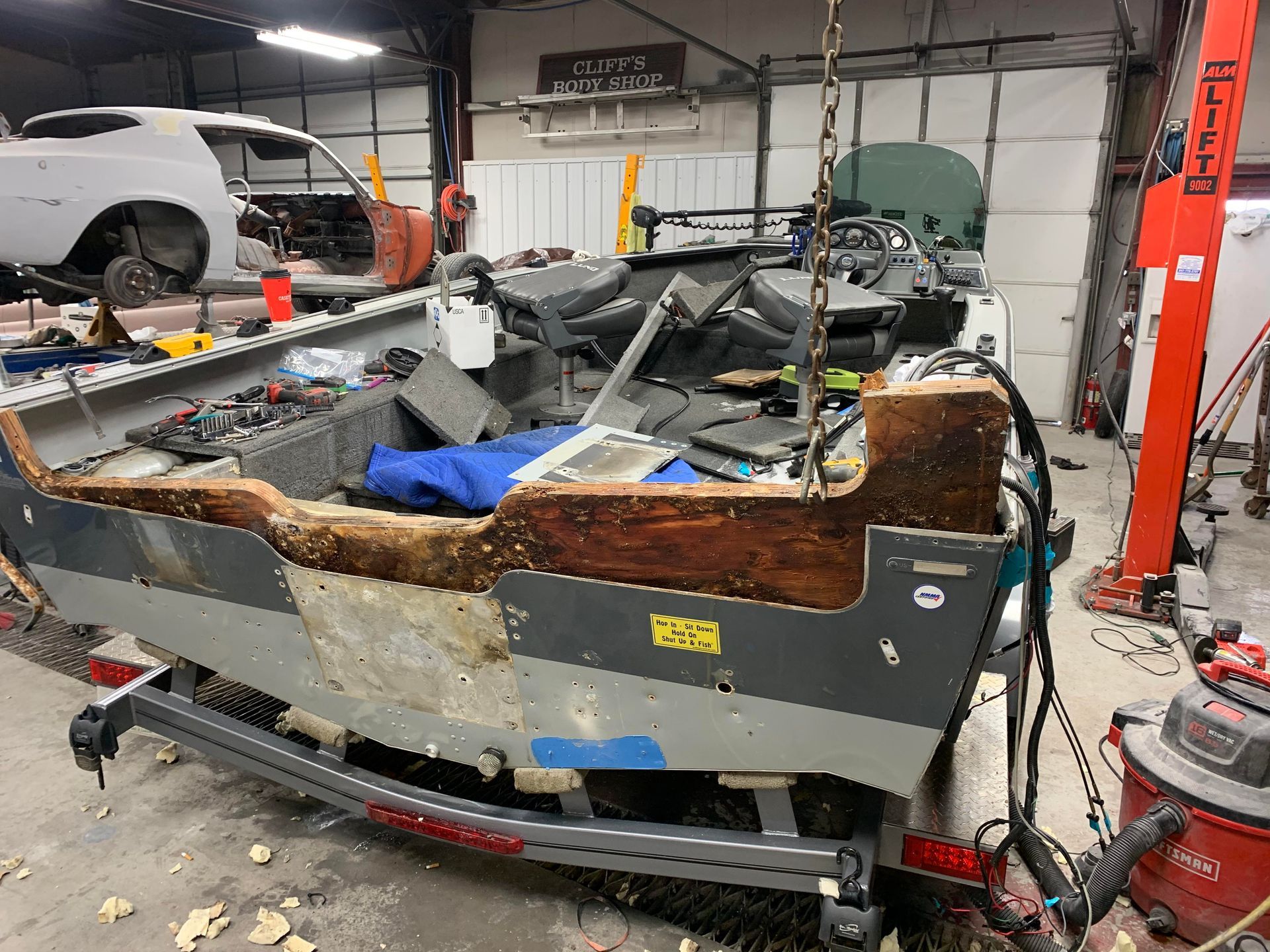 a boat is being repaired in a garage