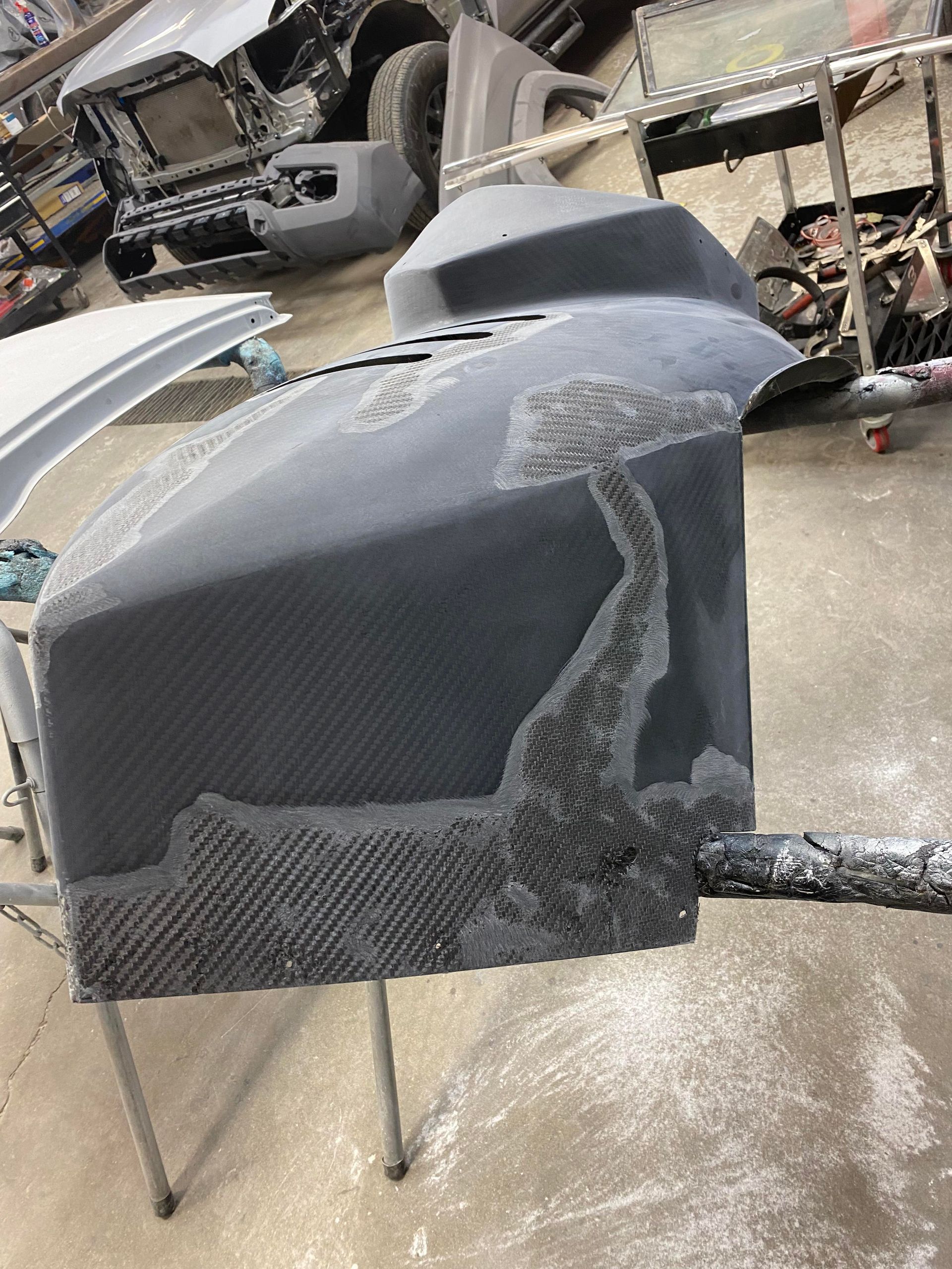 a piece of plastic is sitting on a table in a garage