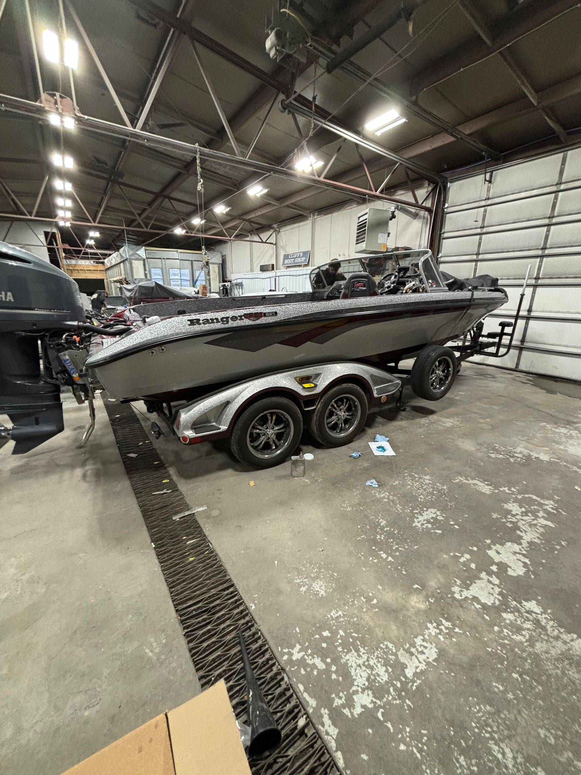 a boat is parked in a garage next to a garage door