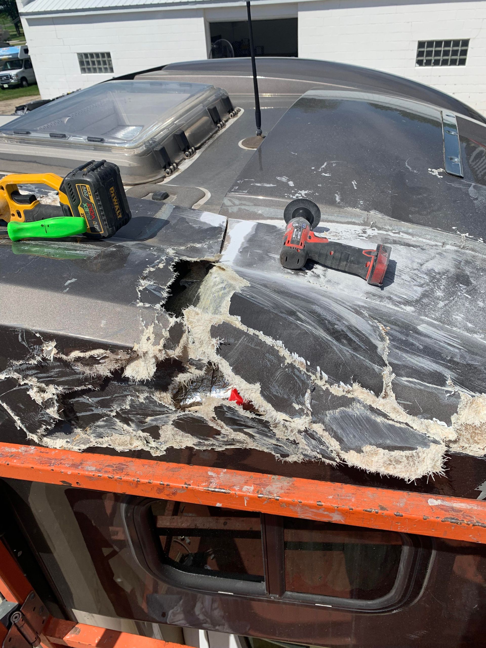 a drill is sitting on top of a roof with a hole in it