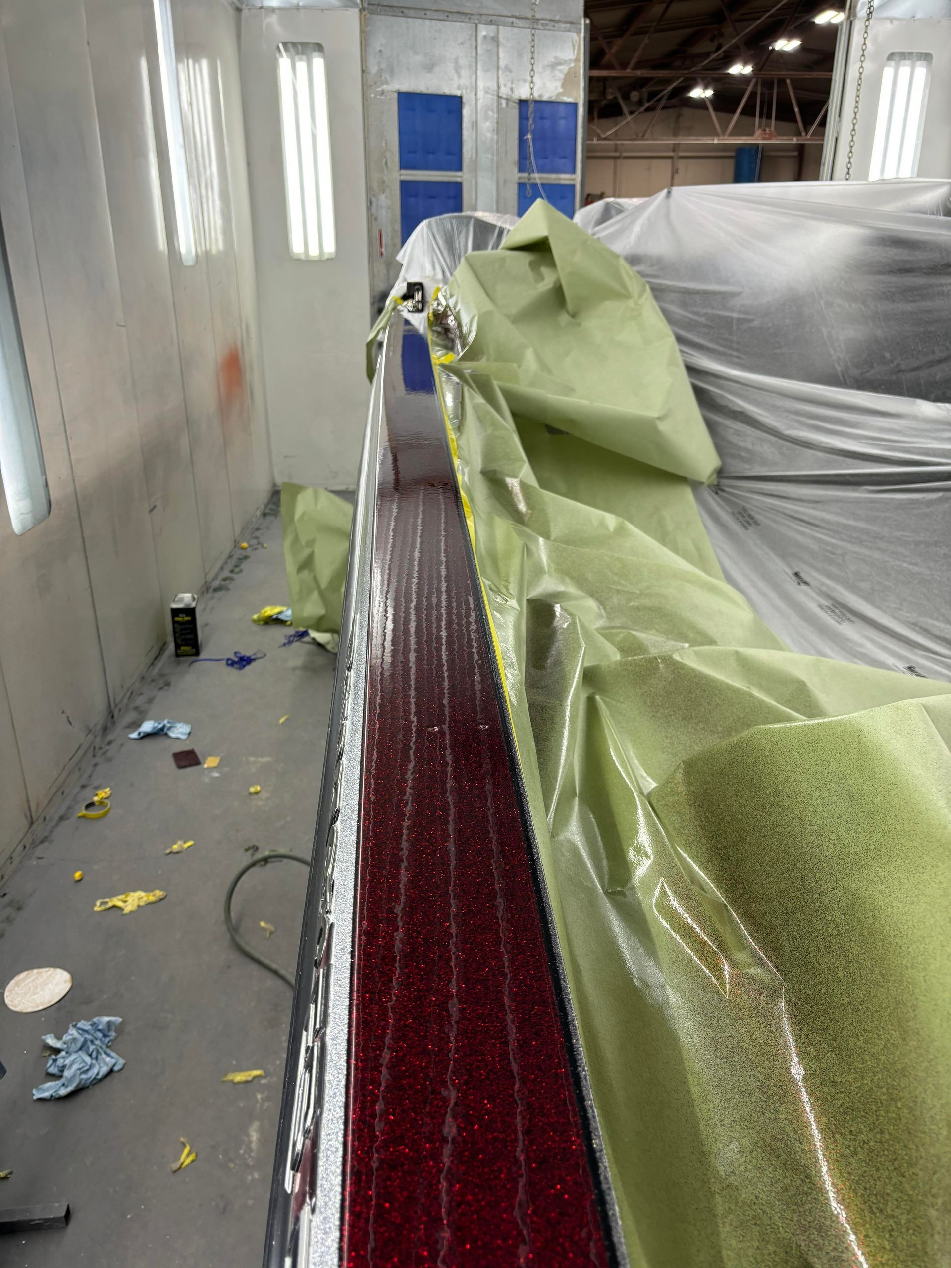 a room with a red floor and a green tarp on the floor