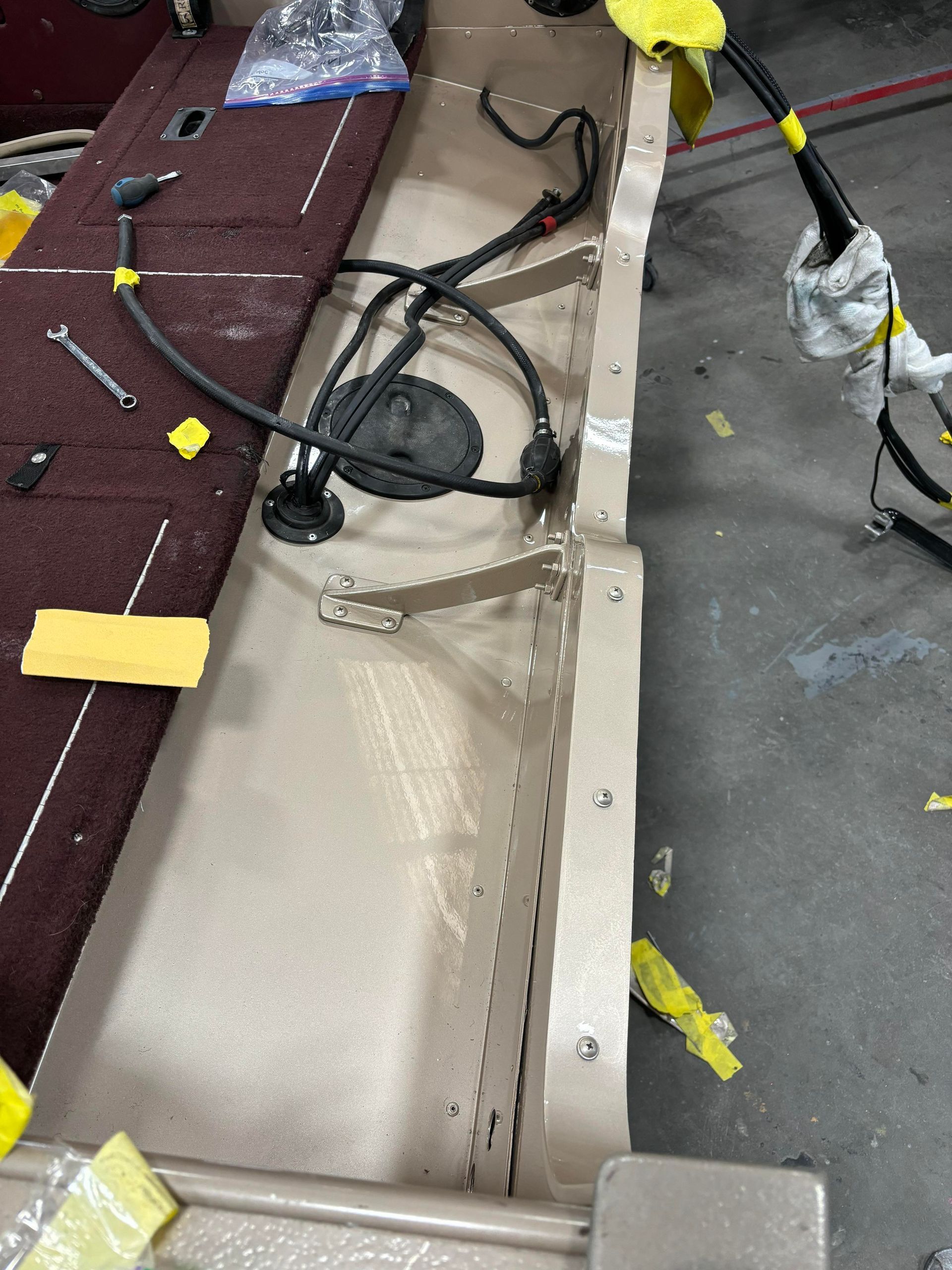 a fishing boat is being repaired in a garage