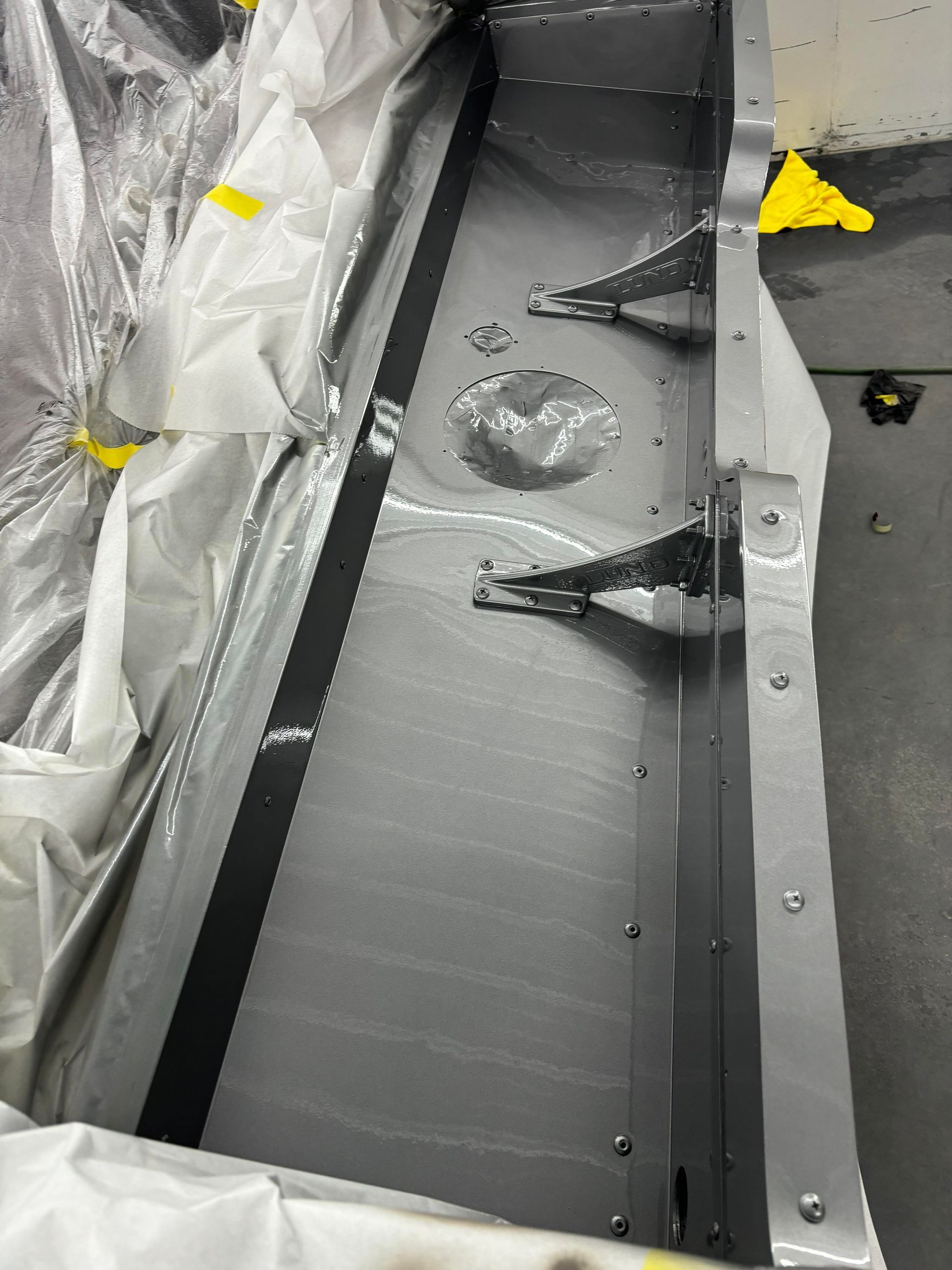 a piece of metal is covered in plastic and has holes in it