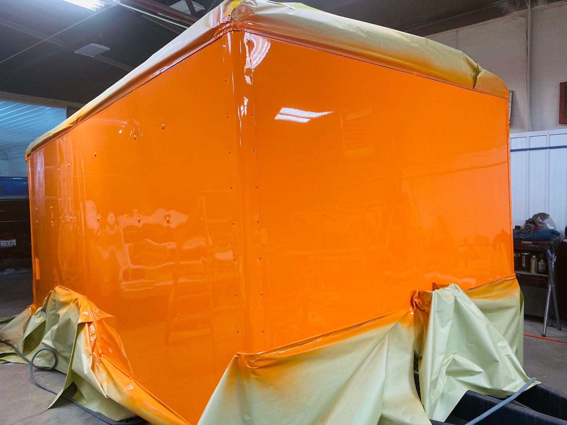 a large orange box is sitting on top of a table in a room
