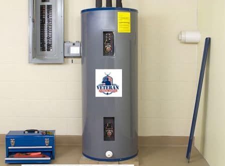 Electric water heater in a utility room next to a breaker box and a toolbox.