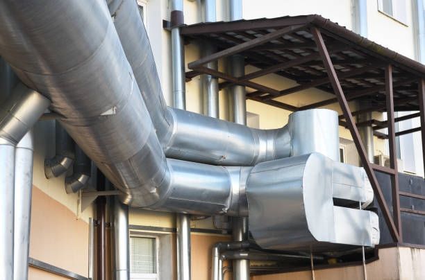 A building with a lot of pipes coming out of it