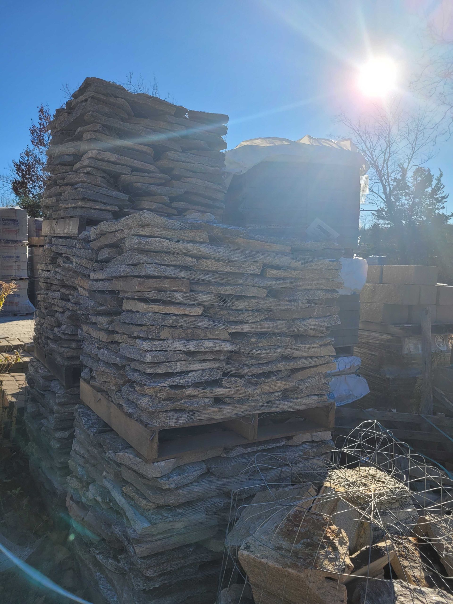 A pile of rocks stacked on top of each other on a wooden pallet.