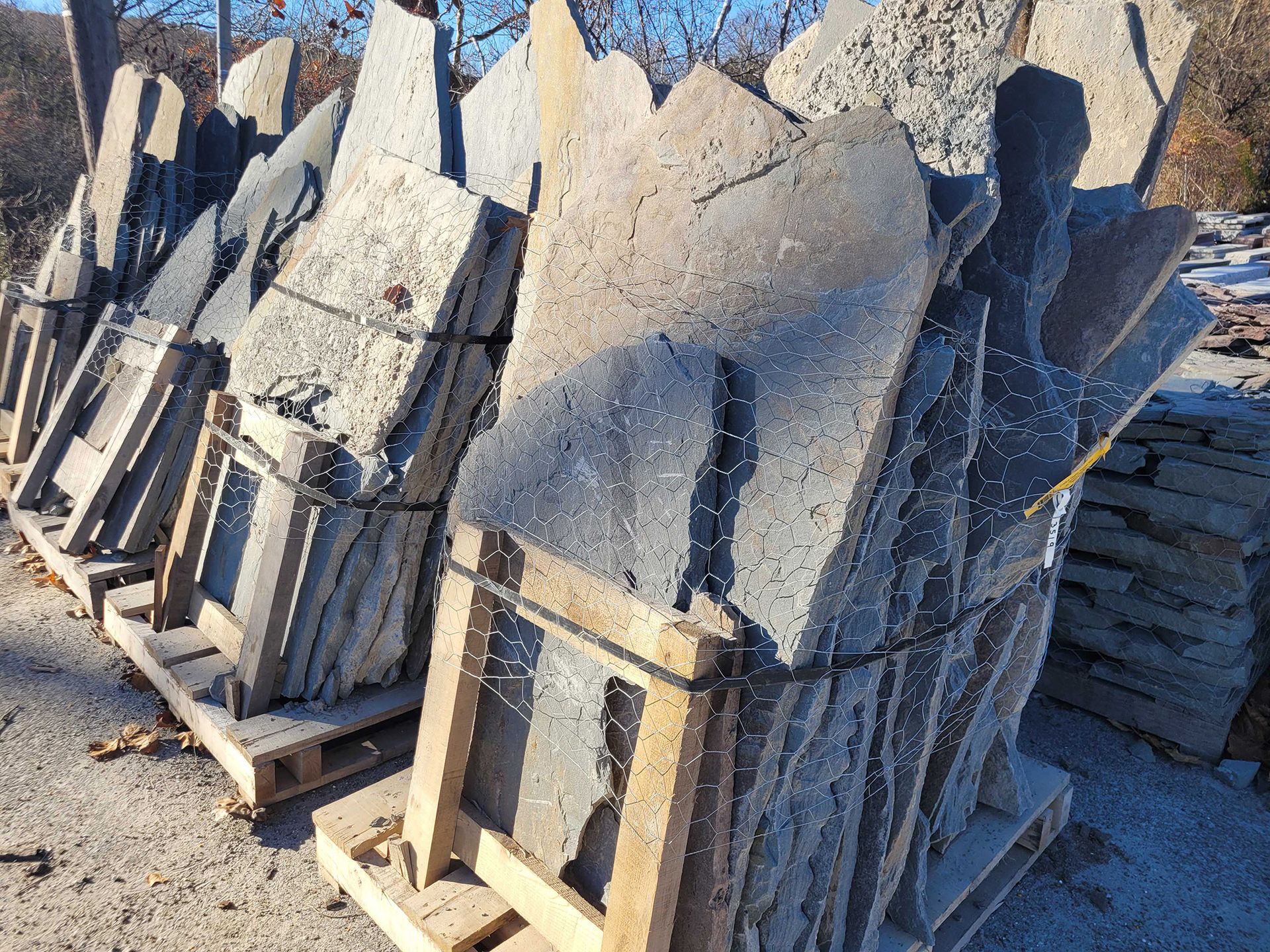 A pile of rocks stacked on top of each other on wooden pallets.