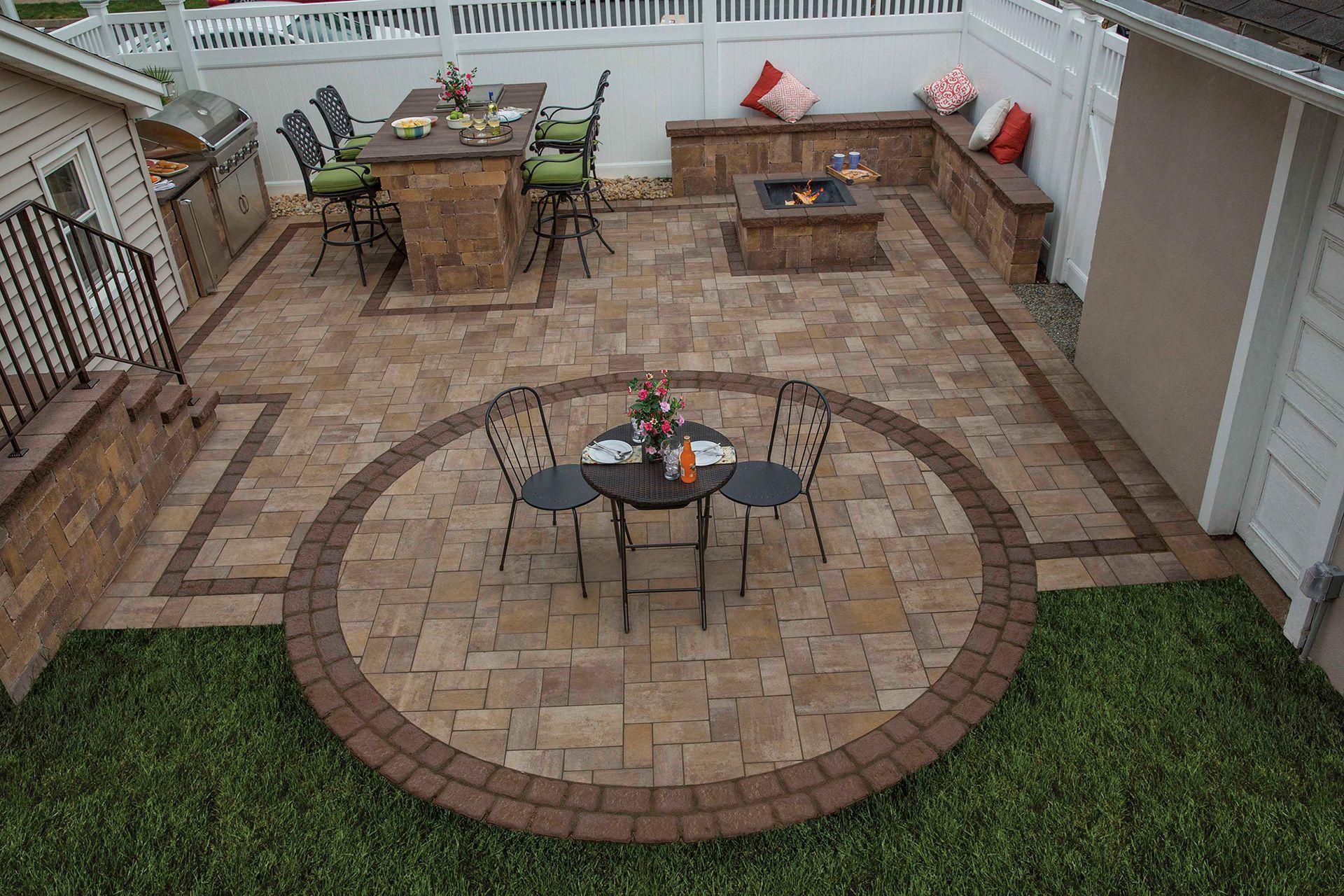 An aerial view of a patio with a table and chairs in a circle.