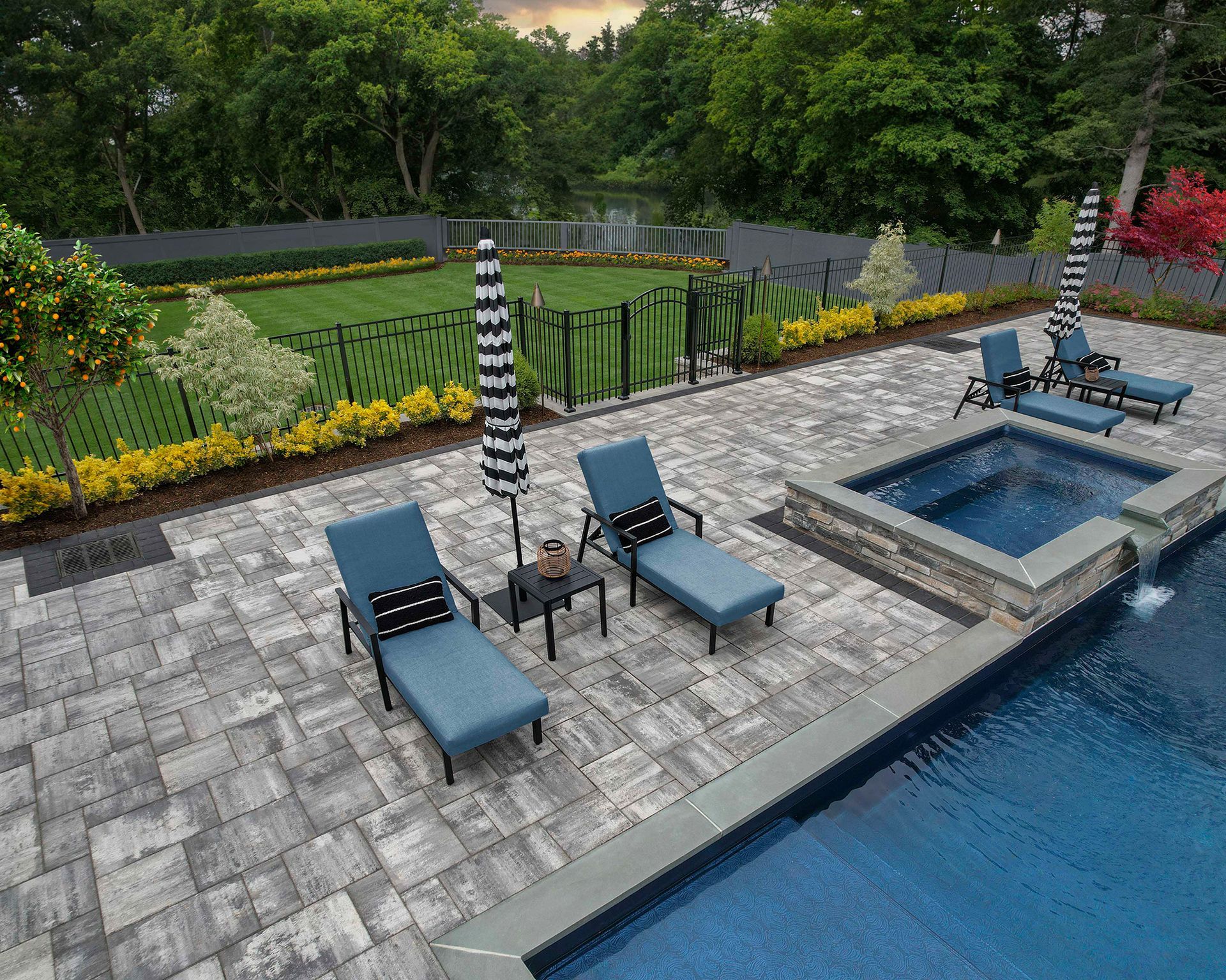 An aerial view of a swimming pool with lounge chairs and umbrellas.