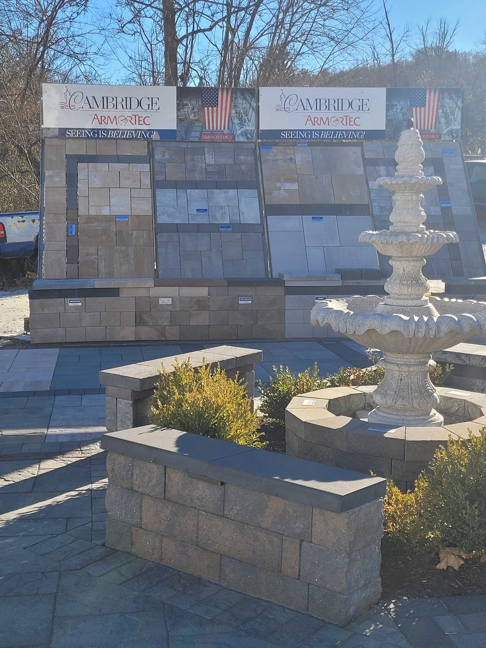 A fountain sits in front of a display of bricks and tiles