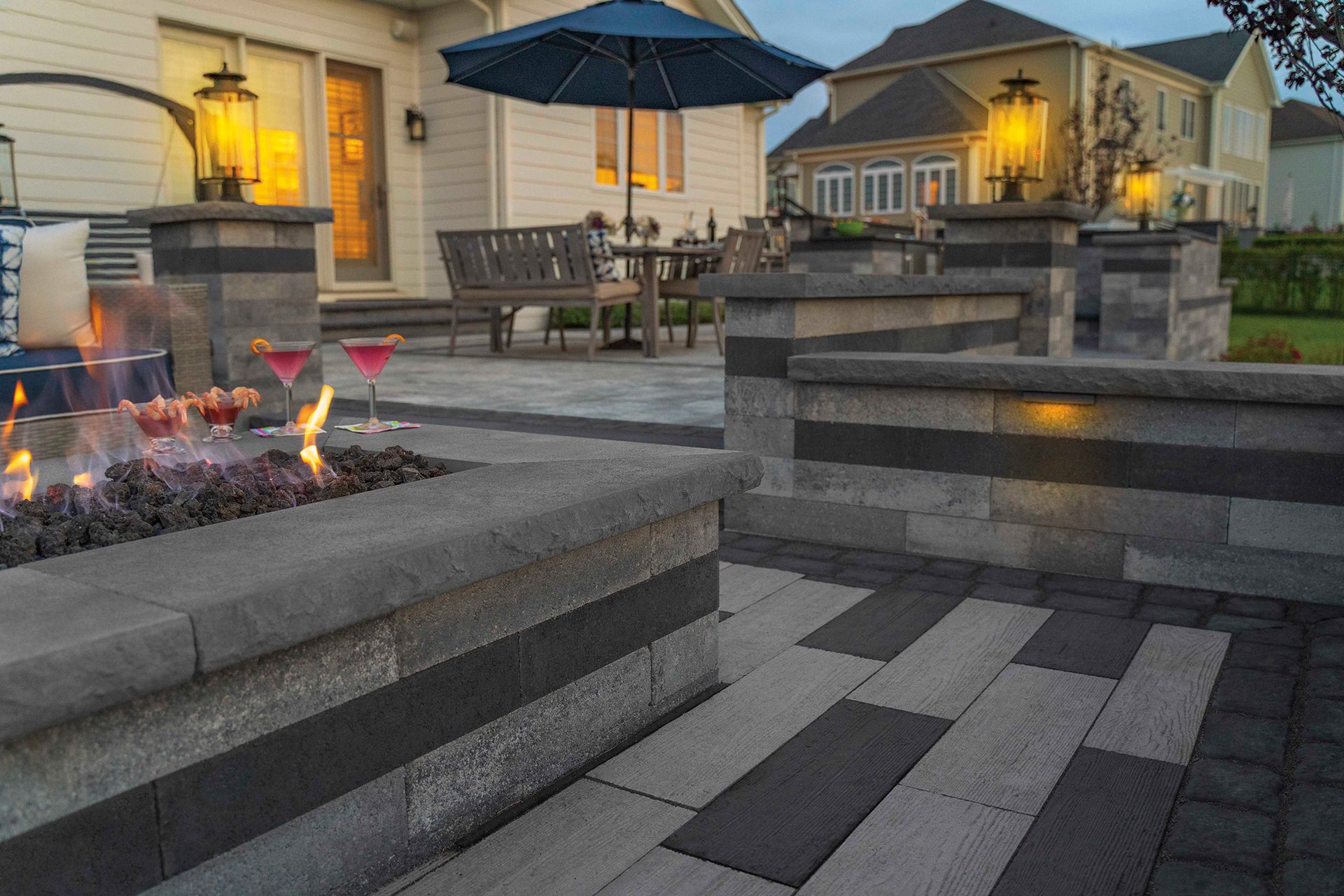 There is a fire pit in the middle of the patio.