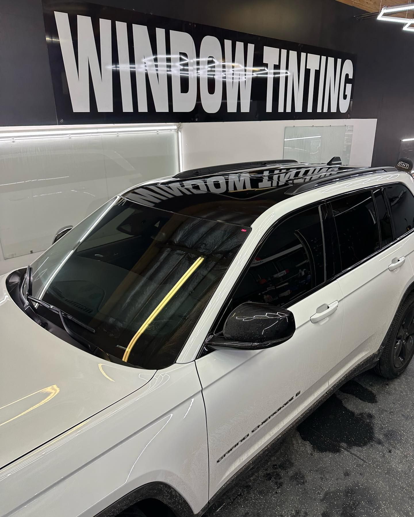 White car with dark window tint