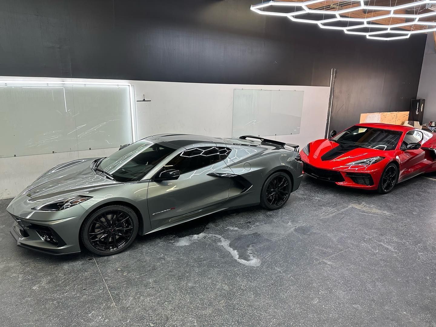 Gray and red Chevrolet cars