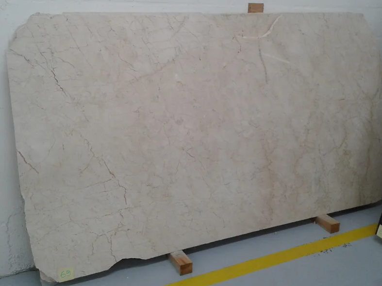 A large piece of marble is sitting on a wooden stand.