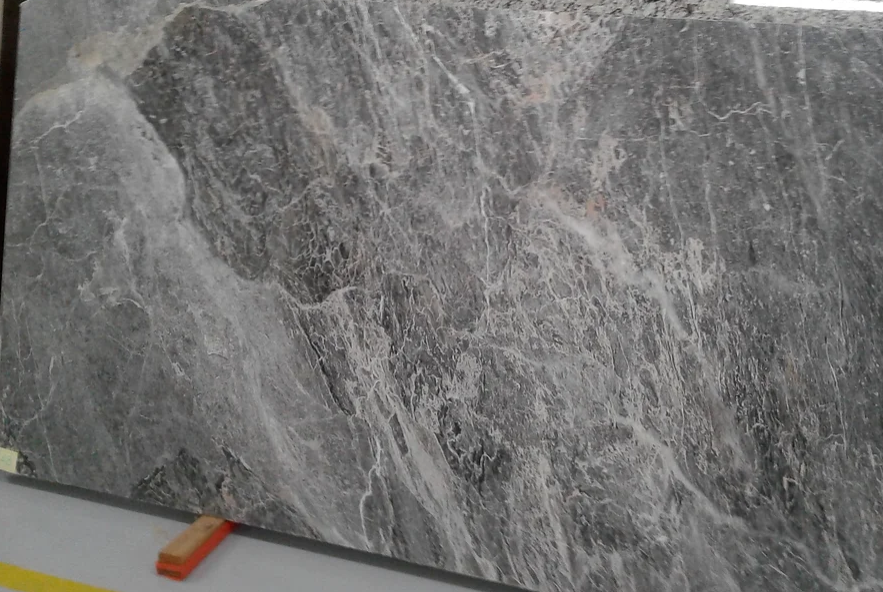A large gray marble slab is sitting on top of a table.