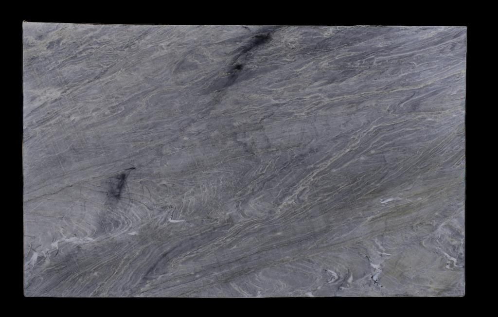 A close up of a gray marble slab on a black background.