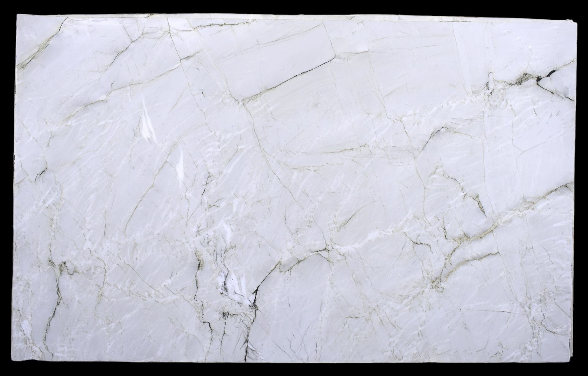 A close up of a white marble slab on a black background.