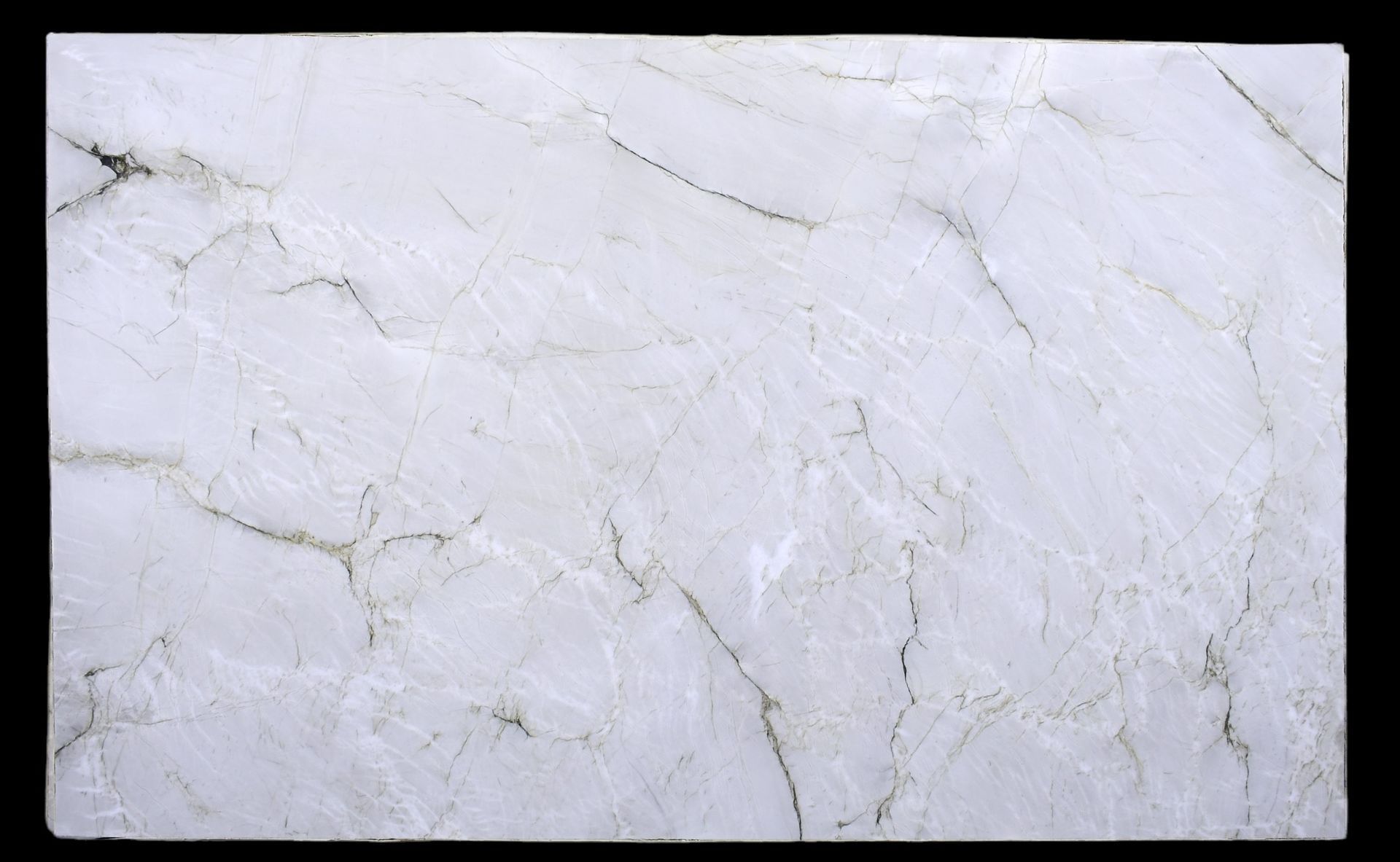 A close up of a white marble slab on a black background.