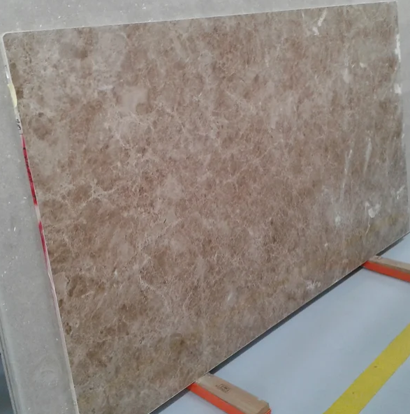 A large piece of marble is sitting on a wooden stand.