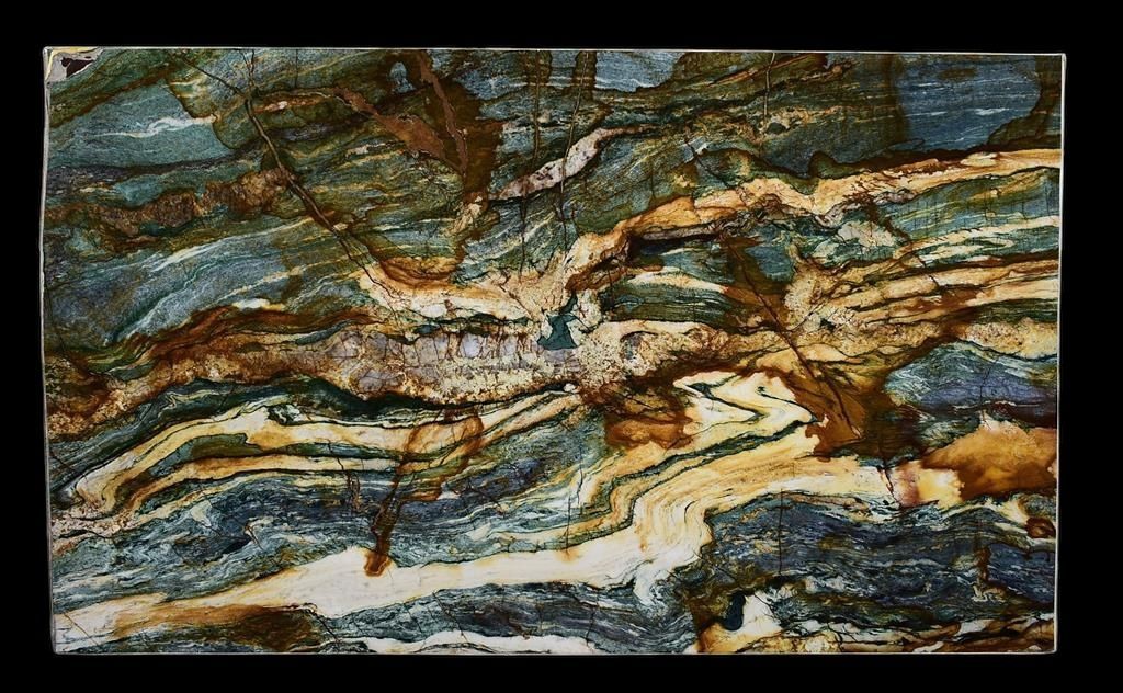 A close up of a piece of marble with a swirl pattern